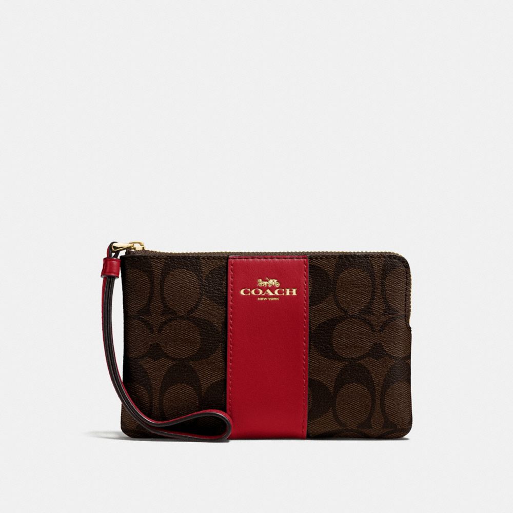 COACH CORNER ZIP WRISTLET IN SIGNATURE CANVAS - BROWN/RUBY/IMITATION GOLD - F58035