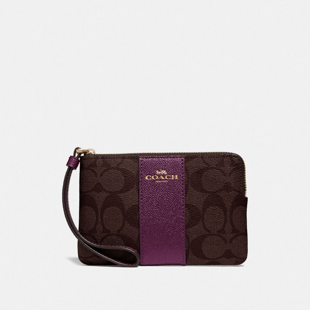 COACH CORNER ZIP WRISTLET IN SIGNATURE CANVAS - IM/BROWN METALLIC BERRY - F58035