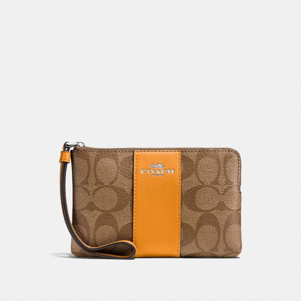 COACH CORNER ZIP WRISTLET IN SIGNATURE CANVAS - SILVER/KHAKI/TANGERINE - f58035