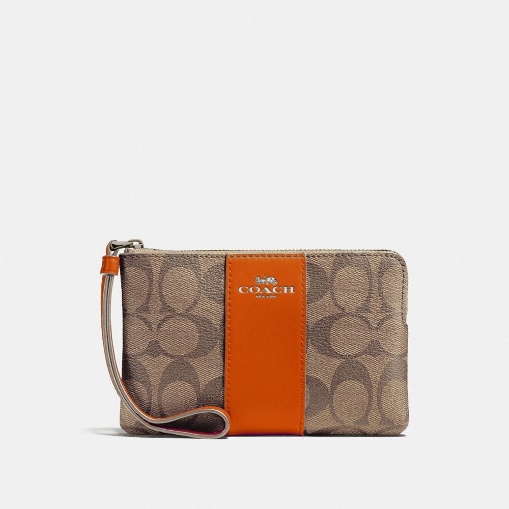 COACH CORNER ZIP WRISTLET IN SIGNATURE CANVAS - KHAKI/ORANGE RED/SILVER - f58035