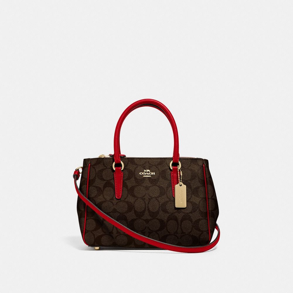 COACH MINI SURREY CARRYALL IN SIGNATURE CANVAS - BROWN/TRUE RED/IMITATION GOLD - F67027