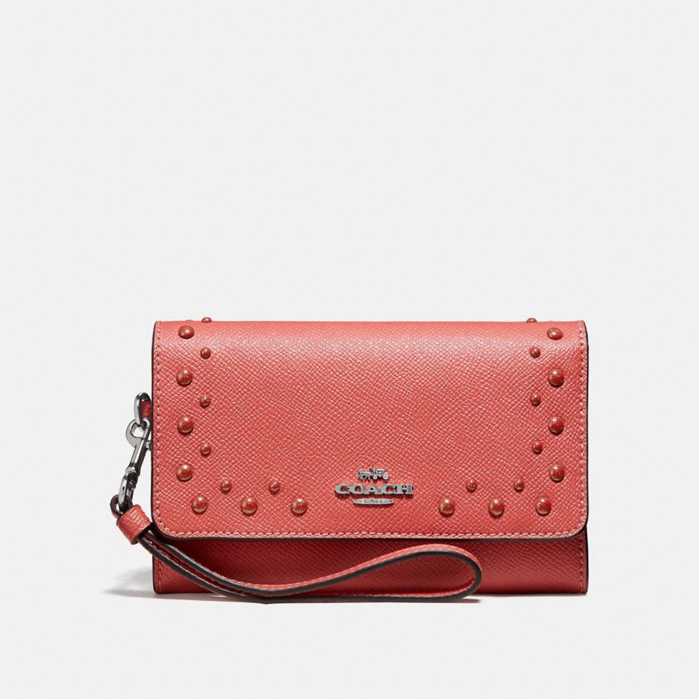 COACH FLAP PHONE WALLET WITH STUDS - CORAL/SILVER - F67500