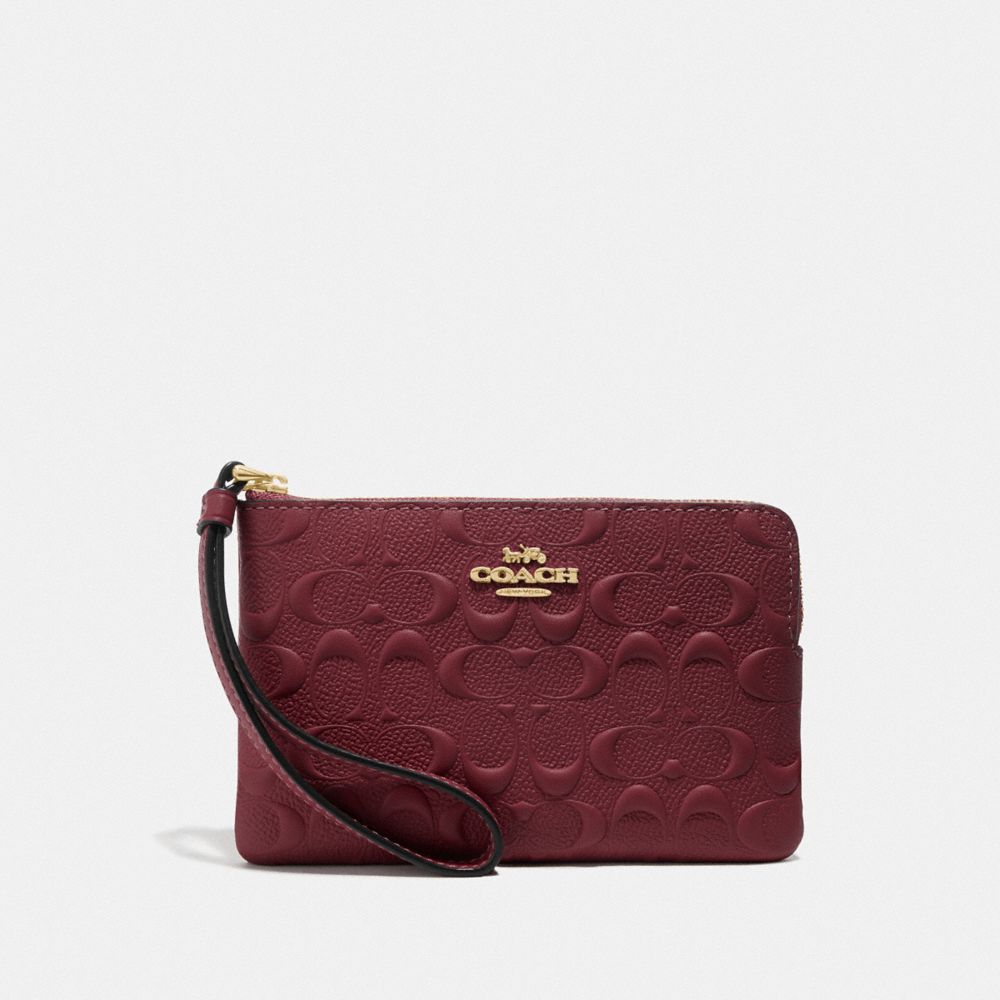 COACH F67555 CORNER ZIP WRISTLET IN SIGNATURE LEATHER WINE/IMITATION-GOLD