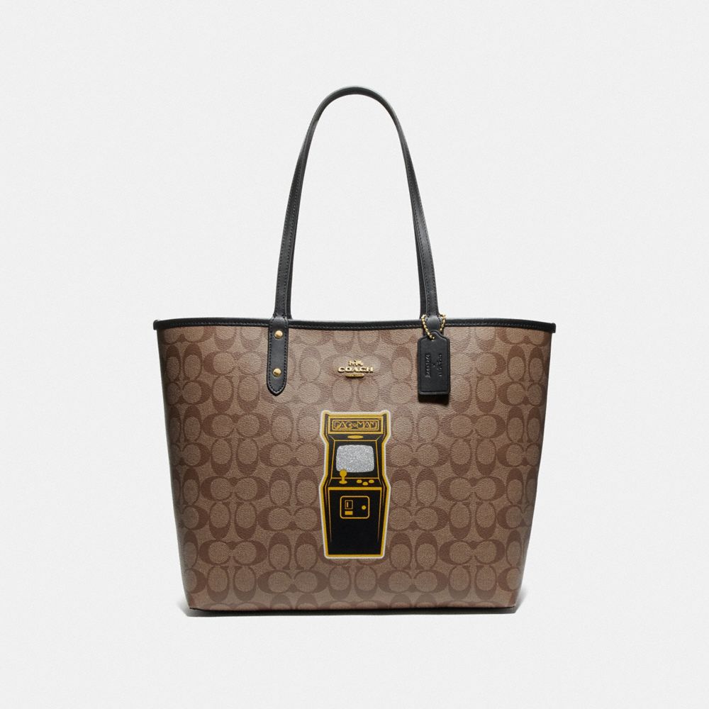 REVERSIBLE CITY TOTE IN SIGNATURE CANVAS WITH PAC-MAN GAME - KHAKI MULTI/BLACK/GOLD - COACH F72899