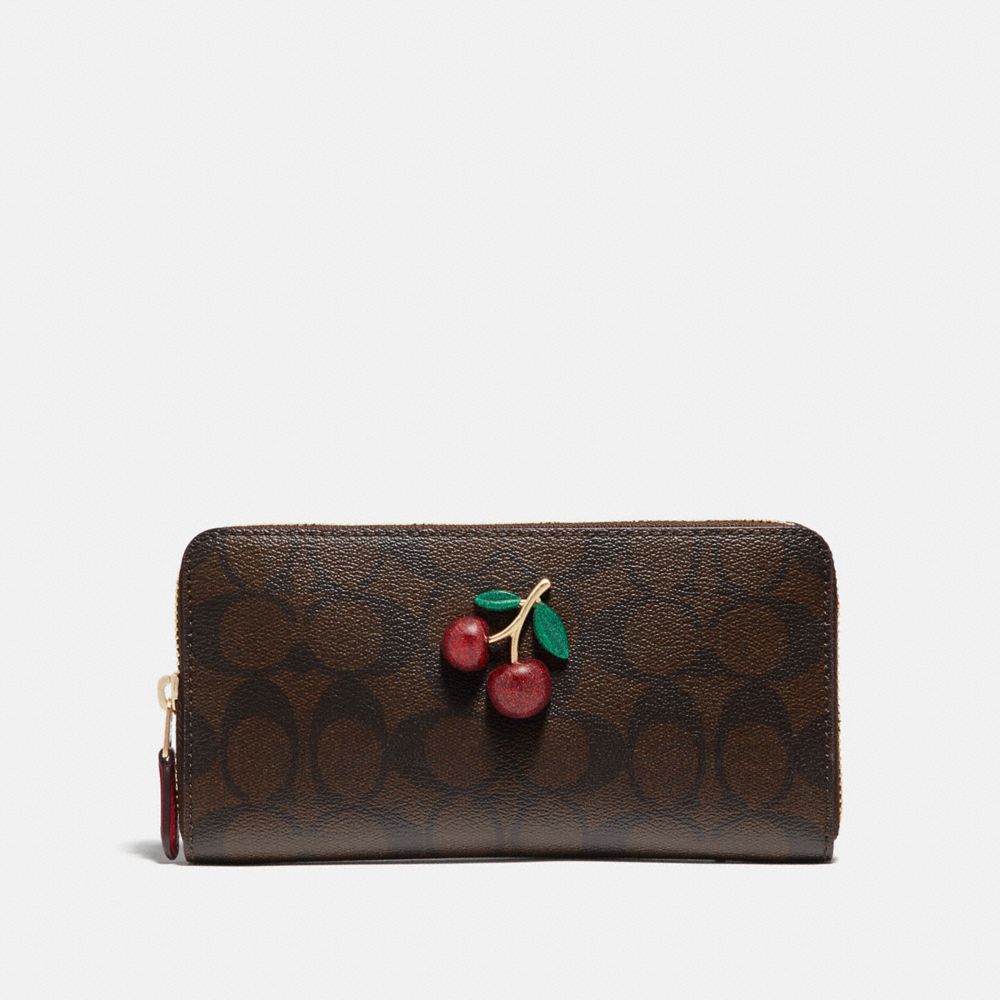 COACH ACCORDION ZIP WALLET IN SIGNATURE CANVAS WITH FRUIT - BROWN/BLACK/TRUE RED/GOLD - F73081