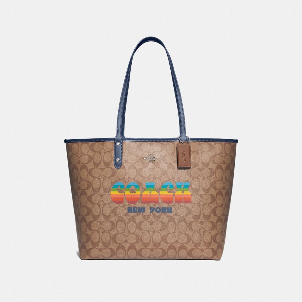 REVERSIBLE CITY TOTE IN SIGNATURE CANVAS WITH RAINBOW COACH ANIMATION - F73324 - KHAKI/DENIM/SILVER