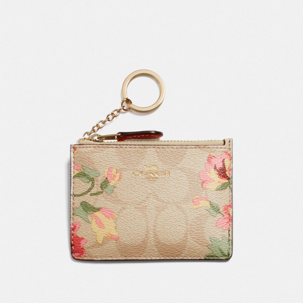 COACH MINI SKINNY ID CASE IN SIGNATURE CANVAS WITH LILY PRINT - LIGHT KHAKI/PINK MULTI/IMITATION GOLD - F73367