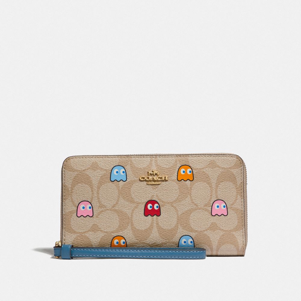 COACH F73394 - LARGE PHONE WALLET IN SIGNATURE CANVAS WITH PAC-MAN GHOSTS PRINT LIGHT KHAKI MULTI/GOLD