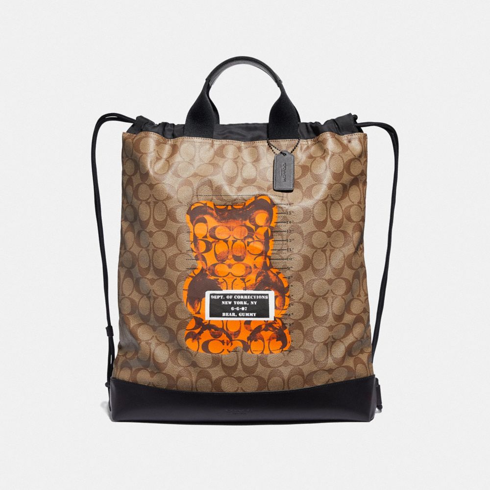 COACH F76805 - TERRAIN DRAWSTRING BACKPACK IN SIGNATURE CANVAS WITH VANDAL GUMMY TAN/BLACK ANTIQUE NICKEL