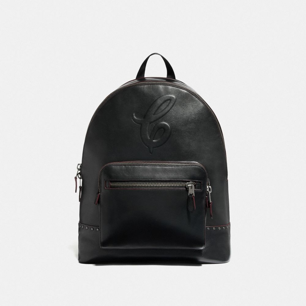 WEST BACKPACK WITH SIGNATURE MOTIF AND STUDS - QB/BLACK - COACH F76909