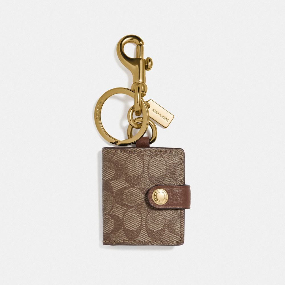 COACH PICTURE FRAME BAG CHARM IN SIGNATURE CANVAS - KHAKI/GOLD - F77675