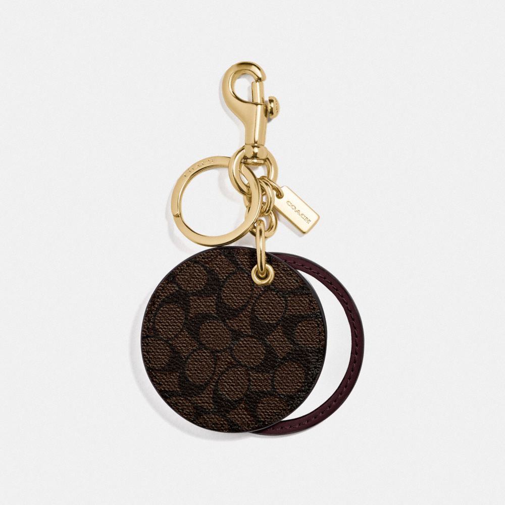 MIRROR BAG CHARM IN SIGNATURE CANVAS - GD/MAHOGANY - COACH F77961