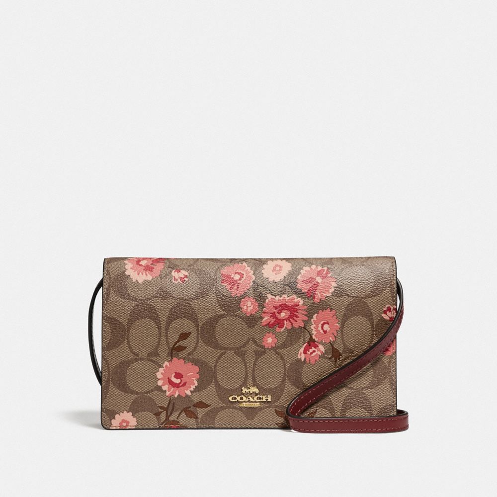 HAYDEN FOLDOVER CROSSBODY CLUTCH IN SIGNATURE CANVAS WITH PRAIRIE DAISY CLUSTER PRINT - F78044 - KHAKI CORAL MULTI/IMITATION GOLD