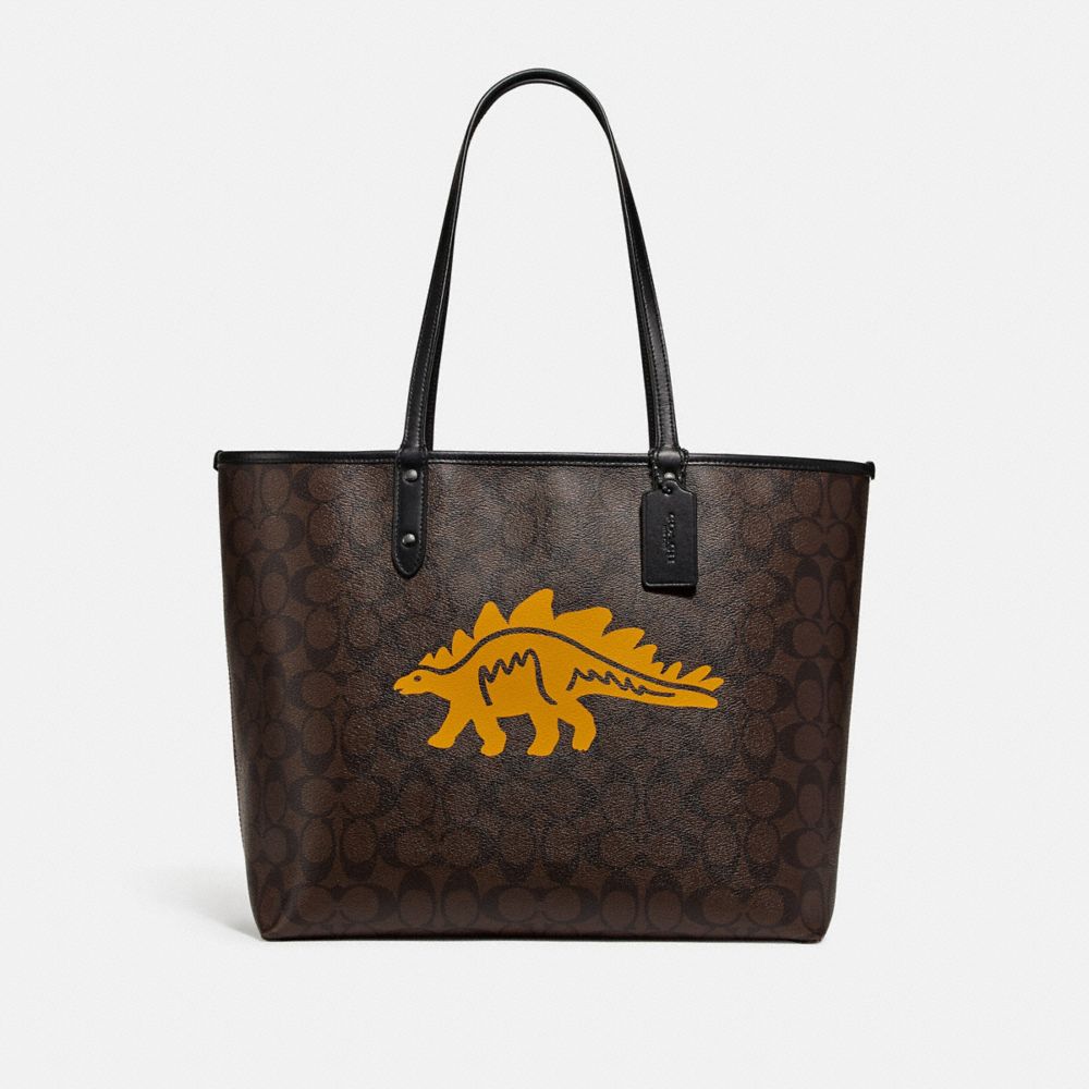 REVERSIBLE CITY TOTE IN SIGNATURE CANVAS WITH DINOSAUR MOTIF - F78255 - QB/BROWN BLACK MULTI