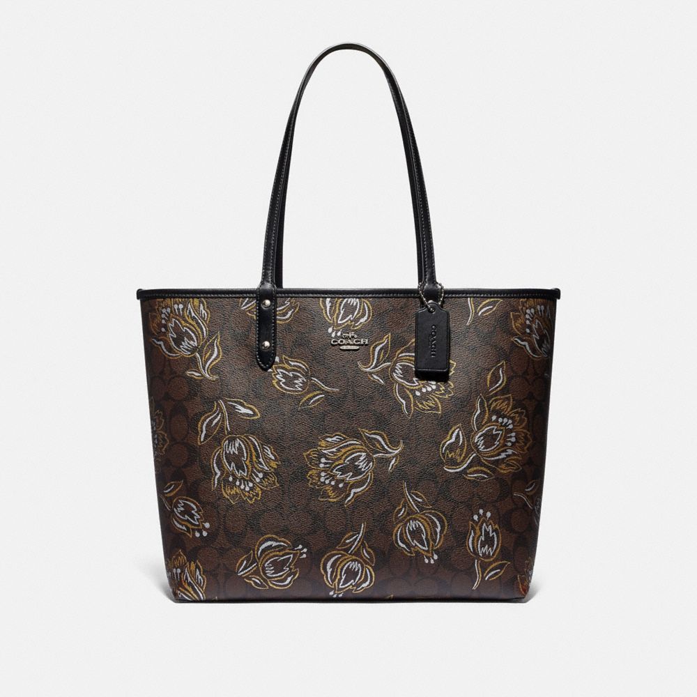 REVERSIBLE CITY TOTE IN SIGNATURE CANVAS WITH TULIP PRINT - F78282 - SV/CHESTNUT METALLIC/BLACK