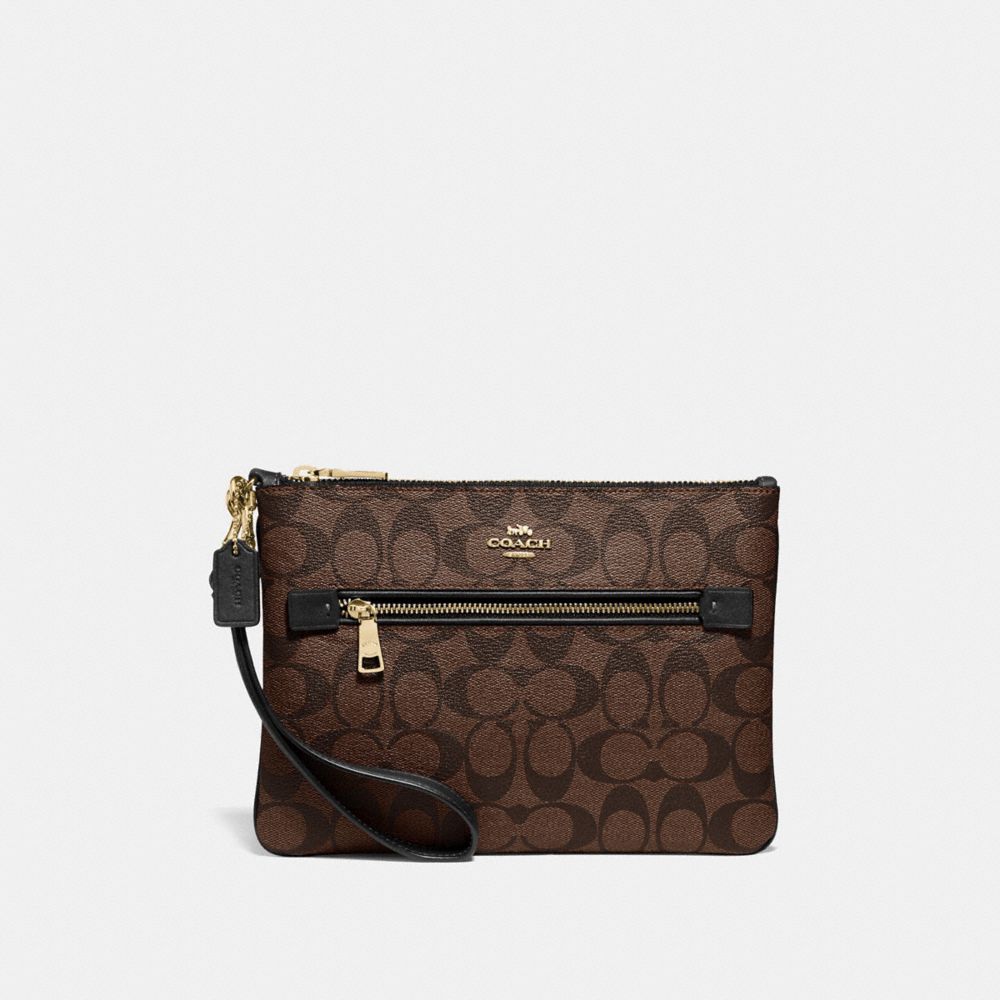 COACH GALLERY POUCH IN SIGNATURE CANVAS - IM/BROWN/BLACK - F79896
