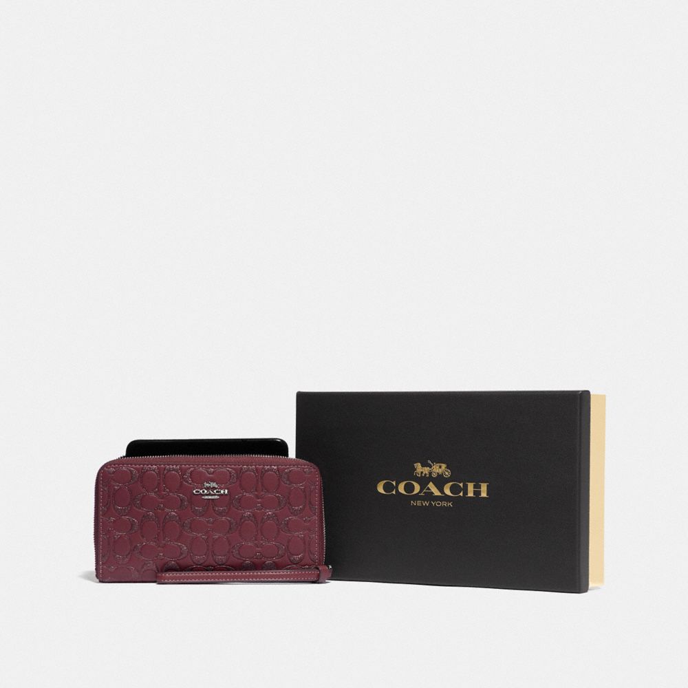 COACH F80222 - BOXED LARGE PHONE WALLET IN SIGNATURE LEATHER SV/WINE