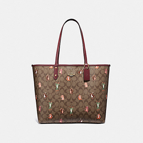 COACH REVERSIBLE CITY TOTE IN SIGNATURE CANVAS WITH PARTY ANIMALS PRINT - IM/KHAKI PINK MULTI WINE - F80246