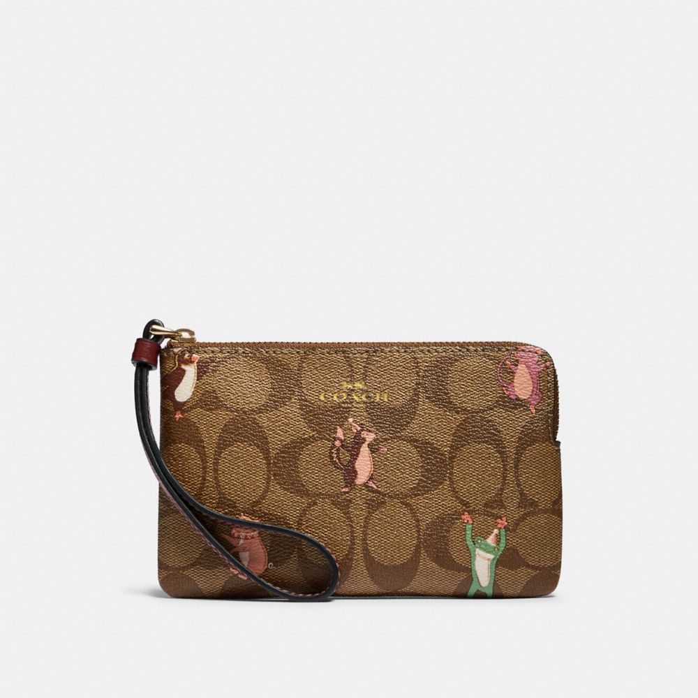 CORNER ZIP WRISTLET IN SIGNATURE CANVAS WITH PARTY ANIMALS PRINT - IM/KHAKI PINK MULTI - COACH F87877