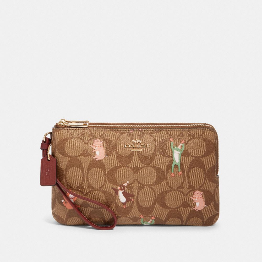 COACH DOUBLE ZIP WALLET IN SIGNATURE CANVAS WITH PARTY ANIMALS PRINT - IM/KHAKI PINK MULTI - F87910