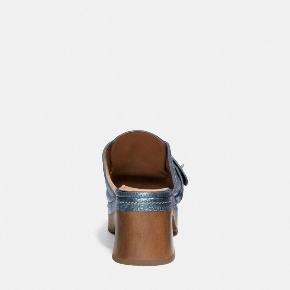 coach turnlock clogs