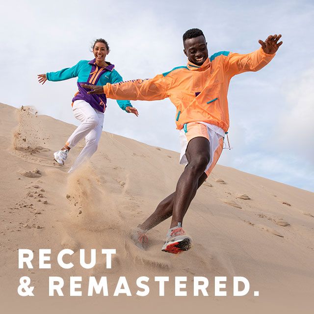 RECUT AND REMASTERED. Man and a woman wearing bright gear in the desert.