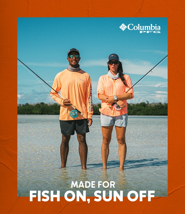 Two people standing in shallow water with fishing gear. MADE FOR FISH ON, SUN OFF