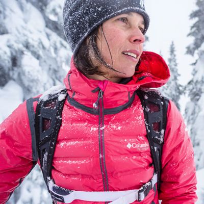 Woman walking on snowy trail