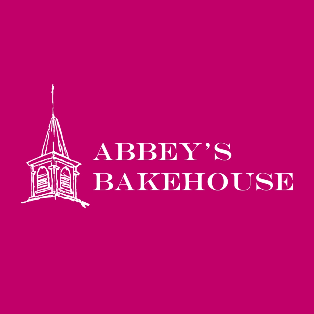 Abbey's Bakehouse logo in white and magenta