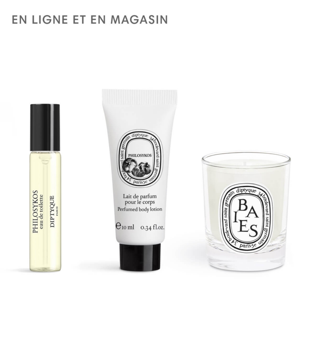 Un grand flacon de parfum transparent avec un bouchon doré