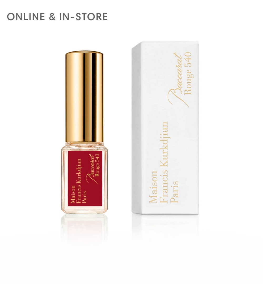 A brown box next to a clear fragrance flacon