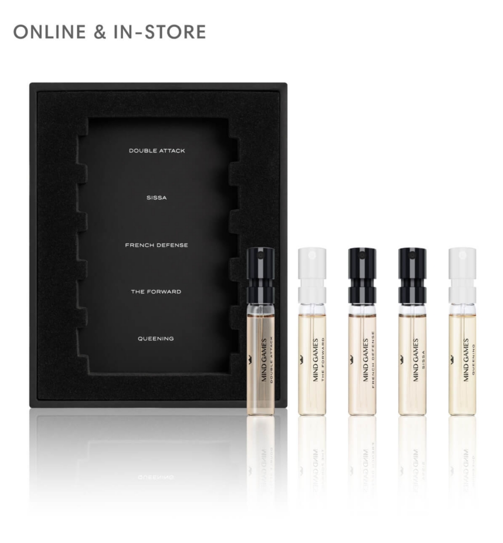 A brown box next to a clear fragrance flacon