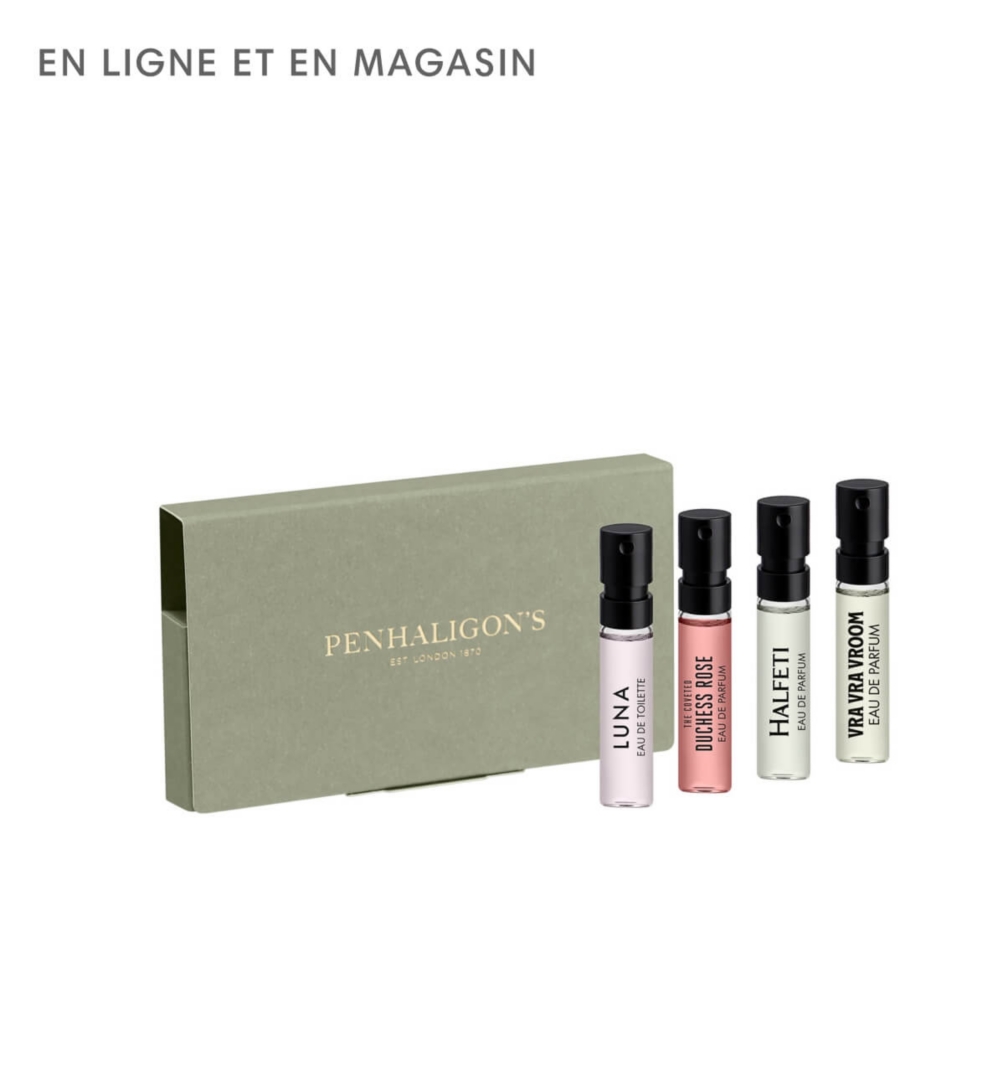 Une boîte brune à côté d'un flacon de parfum transparent