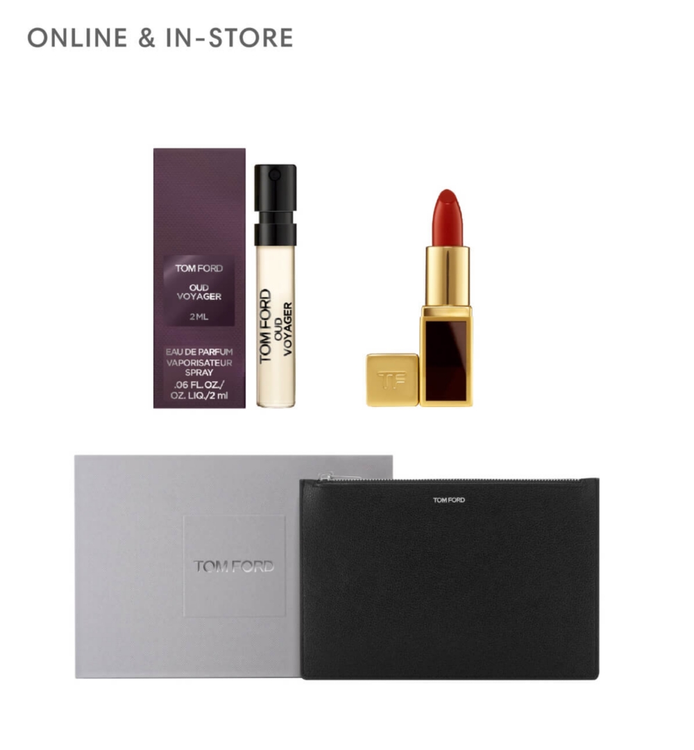 A brown box next to a clear fragrance flacon