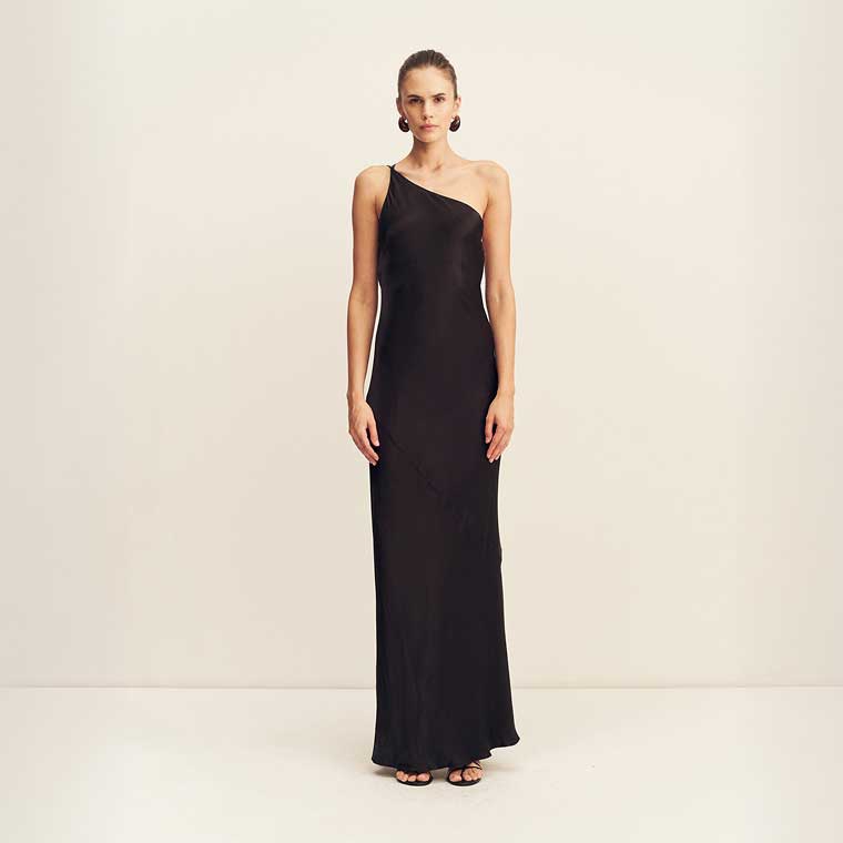A model wearing a black floor-legnth one-shoulder gown.