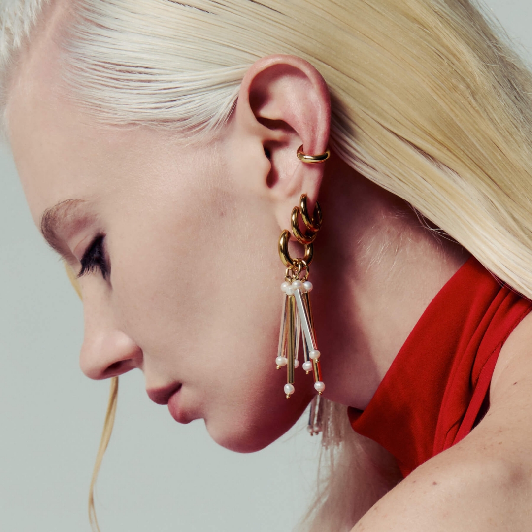 blonde model with several earrings