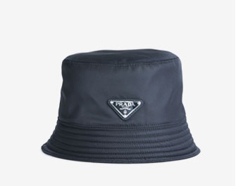 Holt Renfrew image of PRADA. Nylon Bucket Hat. $395. SHOP NOW