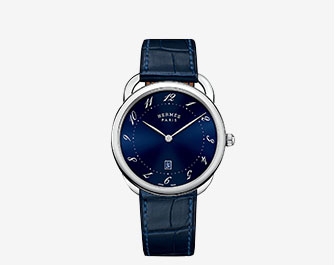 Holt Renfrew image of HERMÈS. Very Large Arceau Stainless Steel Alligator Strap Watch. $4050. SHOP NOW