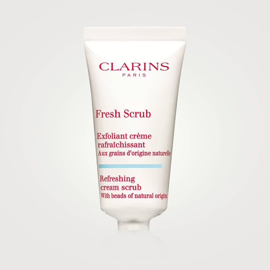A white a red bottle of Clarins face scrub
