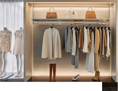 Closet with women's clothing, handbags and shoes