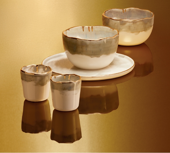 Holt Renfrew image of DOMPIERRE. Gold Collection ceramic dishes handmade from recycled Canadian clay. Goblet. $25 each. Bowl. $35 each. Plate. $32. SHOP DOMPIERRE