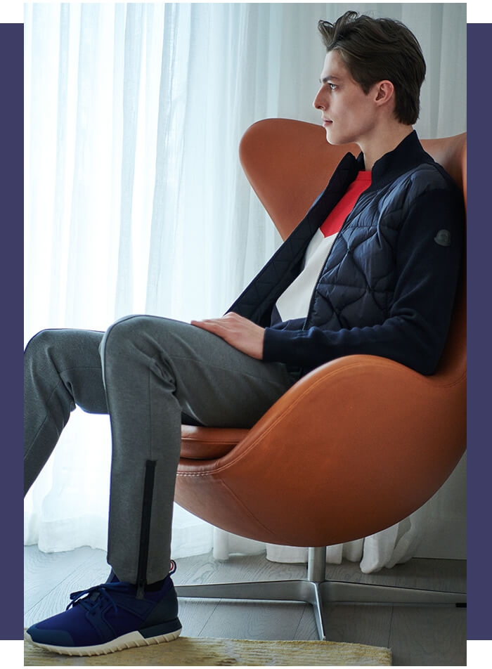 Holt Renfrew image of MONCLER Down Sweater Jacket. $990. Kith Colourblock T-Shirt. $305. Emilien Neoprene Sneakers. $510. MONCLER GRENOBLE Pintucked Jogger Pants. $800.