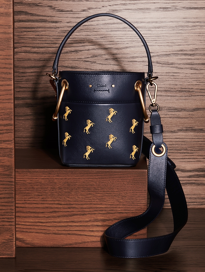 Holt Renfrew Image of CHLOÉ leather Roy small bucket bag with embroidered horses in full blue. $2175. 
