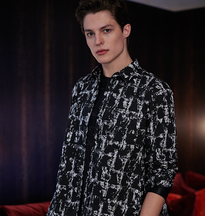 Holt Renfrew image of COMME DES GARÇONS BLACK Printed Shirt. $425. Long Sleeve Top In Camo Print. $240. Cropped Drawstring Pants. $535. FIND IN-STORE