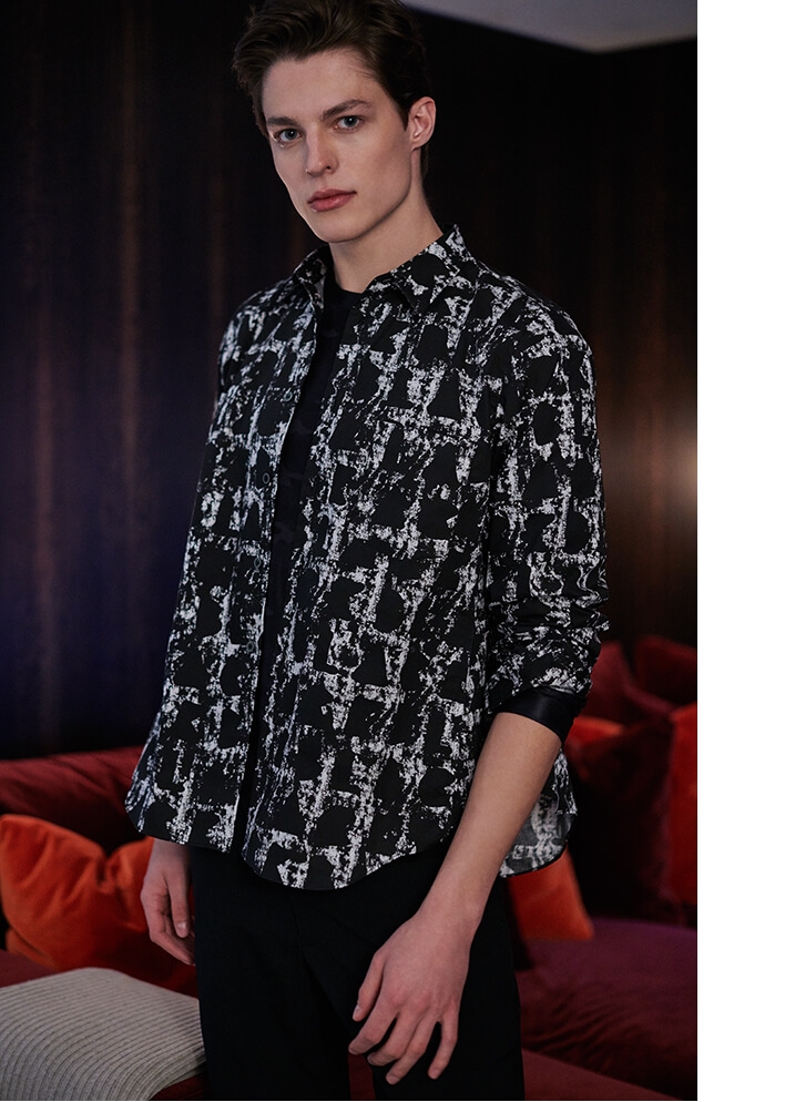 Holt Renfrew image of COMME DES GARÇONS BLACK Printed Shirt. $425. Long Sleeve Top In Camo Print. $240. Cropped Drawstring Pants. $535. FIND IN-STORE