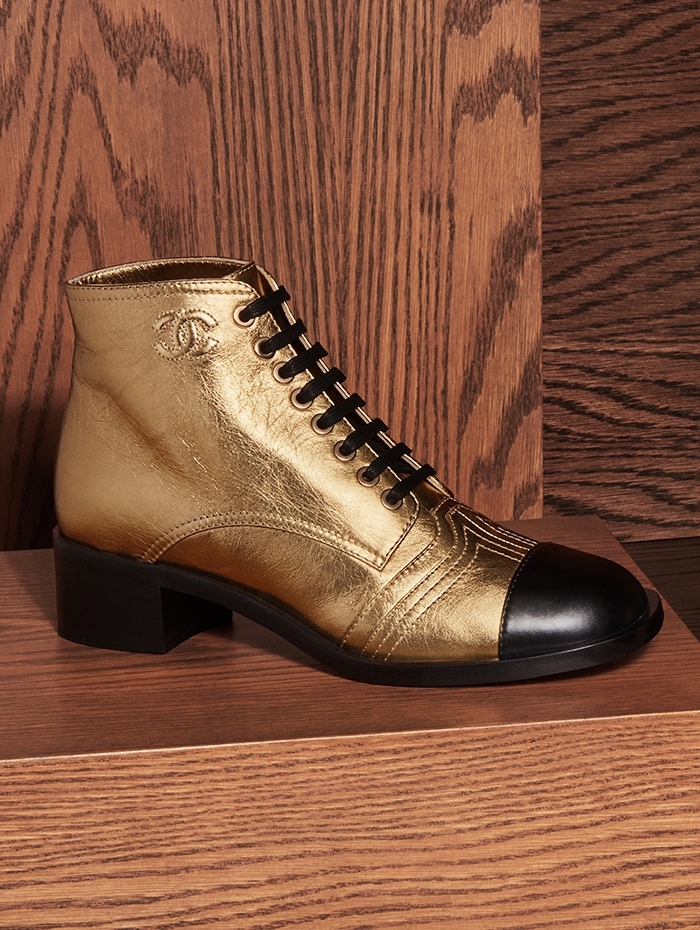 Holt Renfrew Image of CHANEL laminated calfskin lace up boot in gold. Price available upon request. 