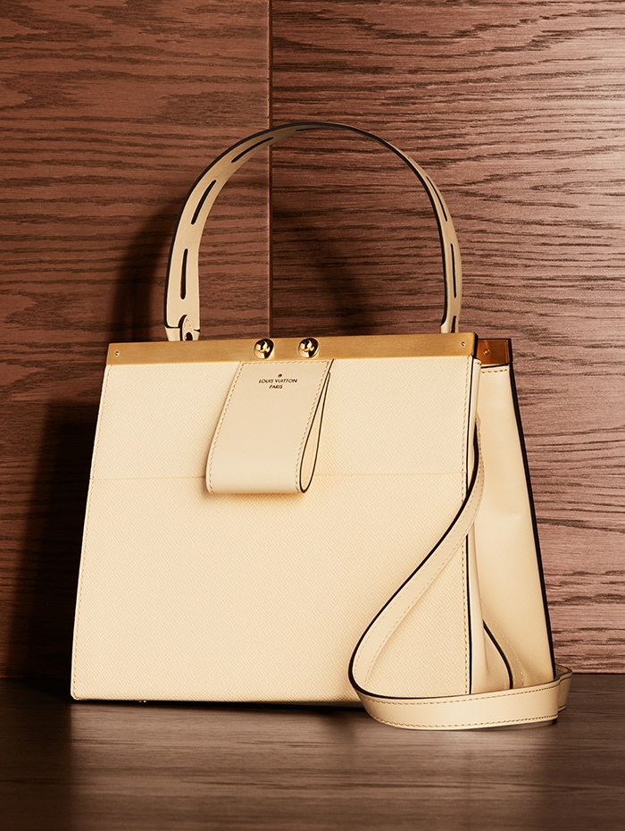 Holt Renfrew Image of LOUIS VUITTON Taiga leather City Frame handbag in banane. $5300. 