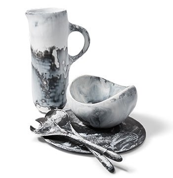 Holt Renfrew image of DINOSAUR DESIGNS Tall Stone jug. $310. Large Beetle bowl. $335. Boulder platter. $190. Long Dew servers. $150.