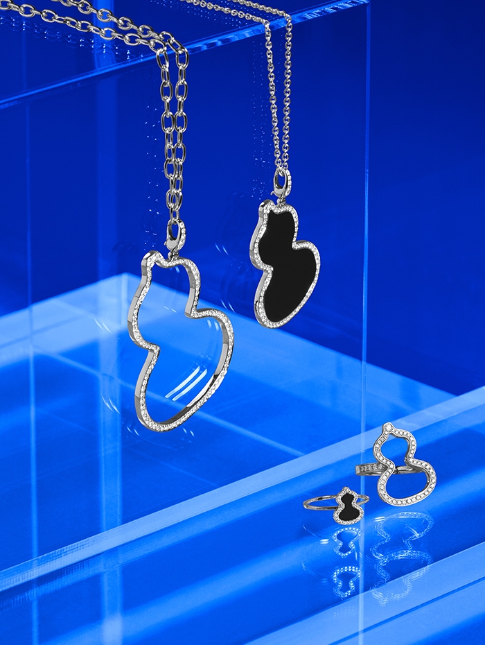Holt Renfrew image of Qeelin Exclusively at Holt Renfrew From the Wulu Collection Large pendant. $16,400. Medium pendant with onyx. $11,200. Petite ring with onyx. $1700. Medium ring. $7700. All in 18K white gold with diamonds.