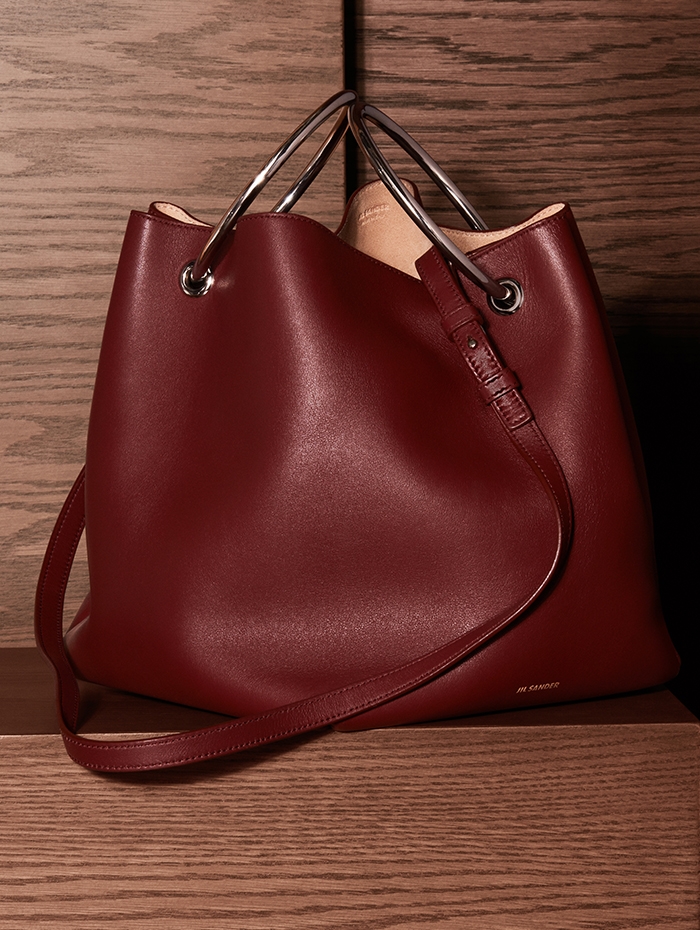Holt Renfrew Image of JIL SANDER calfskin Loop bucket bag in Bordeaux. $2360. Holts Exclusive.  